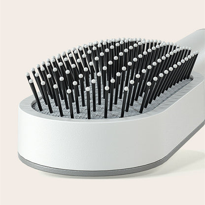PureDetangle self-cleaning detangling hair brush - product photo 3 - AVALDEY